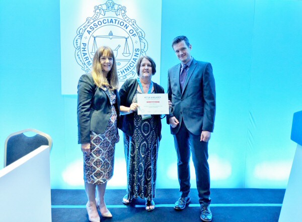 Karen Manson receiving 2nd place alongside Tess Fenn, APTUK and Chris Steng, Helapet Ltd